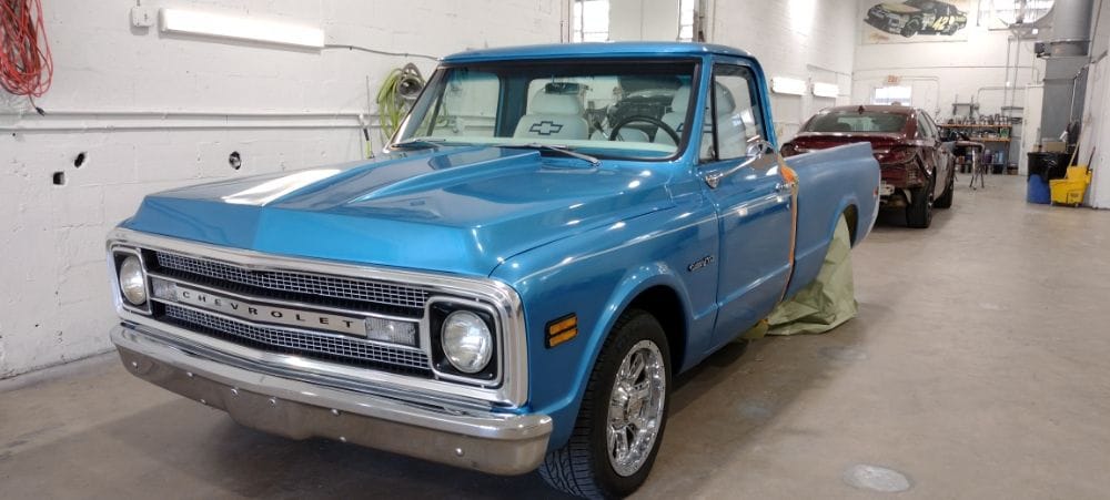 Classic Chevrolet C10 pickup with a fresh bright blue paint job at Auto Shop Repair
